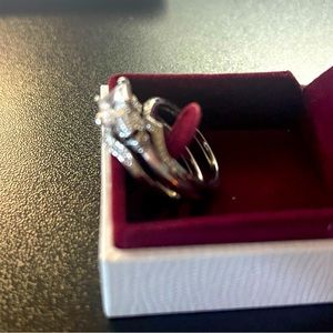 Cubic zirconia skull engagement ring with wedding bands